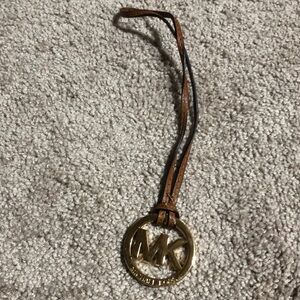 Michael Kors MK gold purse charm with brown strap